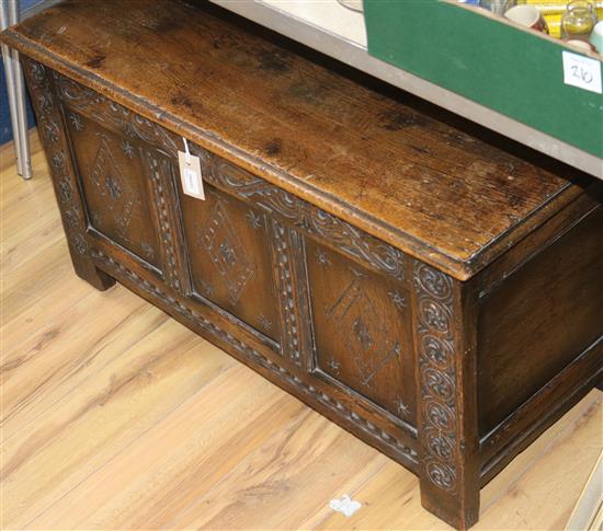 A carved oak small coffer, with hinged top W.91cm